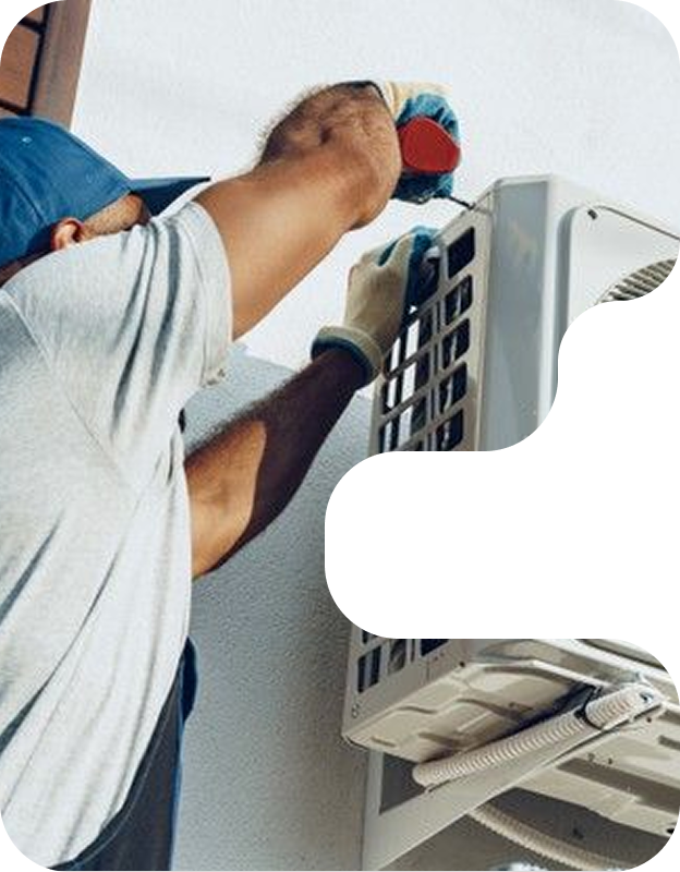 HVAC technician working on air conditioning unit